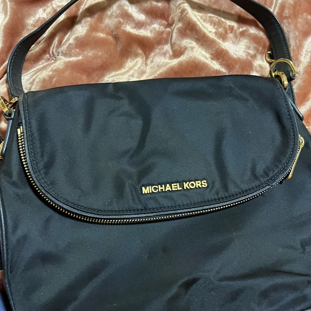 Michael kors black nylon crossbody bag preowned in excellent condition.